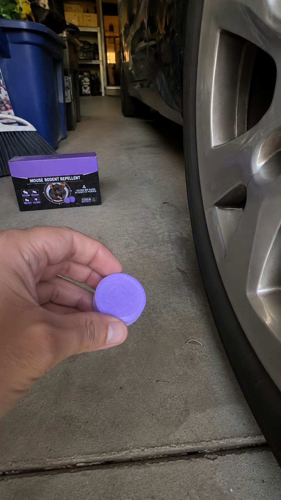 Pest repellent puck in a vehicle engine bay